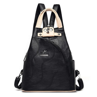 Mochila feminina couro vintage — vista lateral fivelas metálicas
